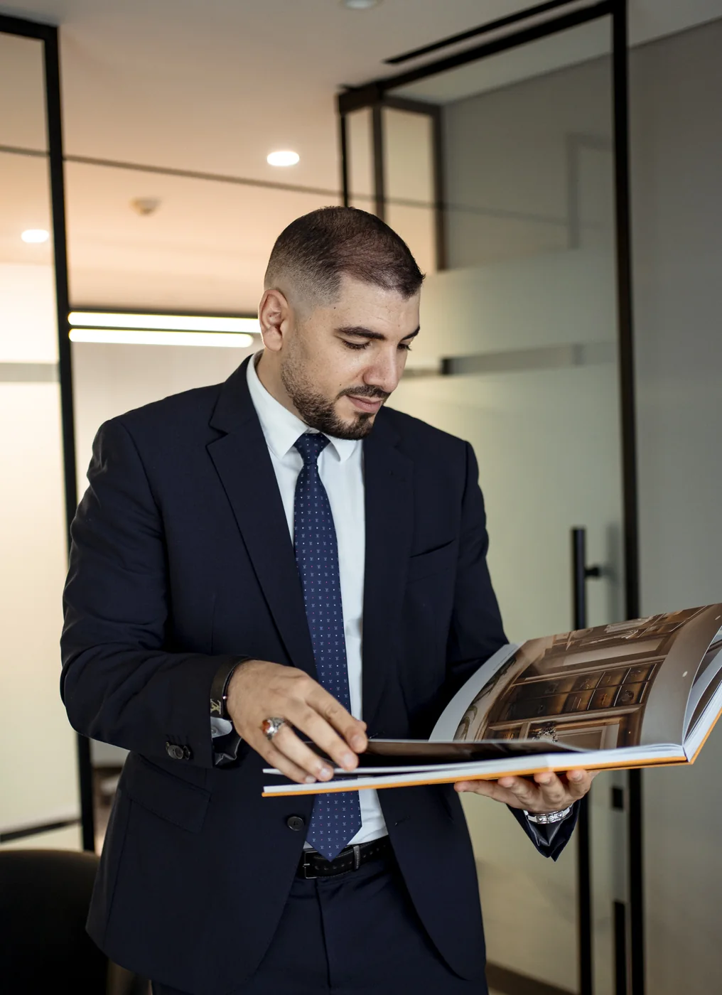 Ahmed El-Sayad reviewing project lookbook with investor