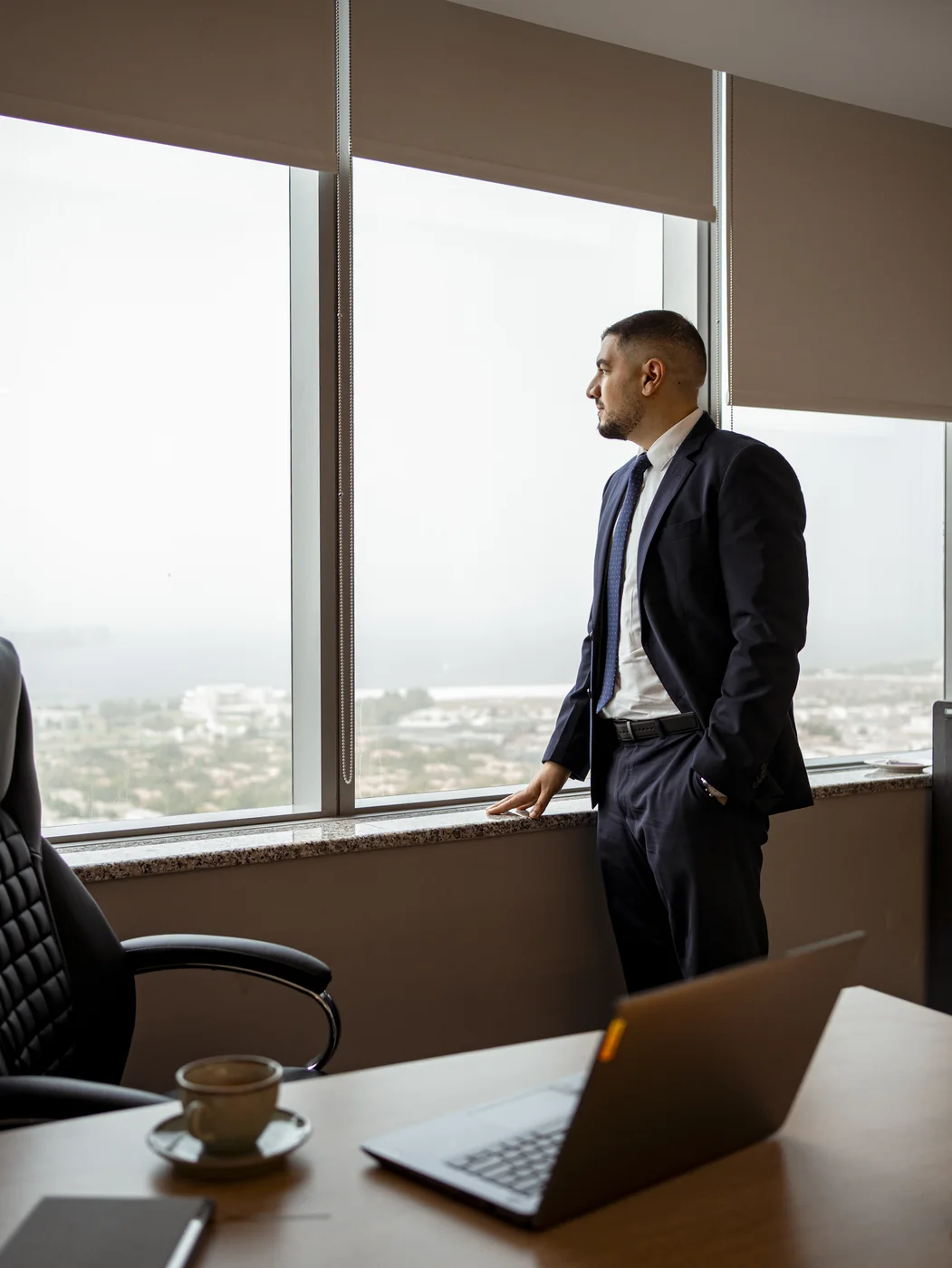 Ahmed El-Sayad overlooking Dubai from a high-rise office